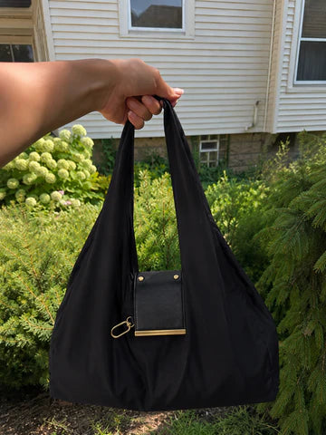 Tote clipped to handbag keychain